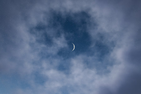 From below 3d rendering of crescent moon in bright blue sky with fluffy clouds during peaceful and calm night during summertimeの写真素材
