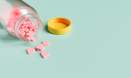 Open bottle with heart-shaped pills on the floor on a green background with space for text. 3d renderingの写真素材