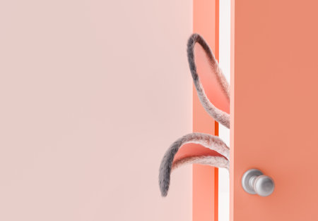 3d rendering of a fluffy bunny ears peeking out from behind a peach-colored door accented with white light. Spring and easter arrival concept.の写真素材