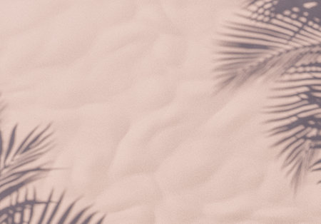 3d rendering of a serene sandy beach texture with the soft shadows of palm leaves. Summer background.の写真素材