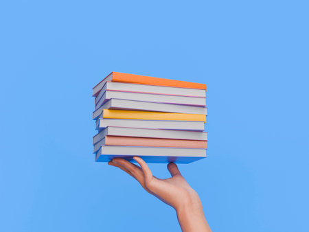 Hand holding a stack of colorful books against a blue background. Concept of education and knowledge. 3d renderingの写真素材