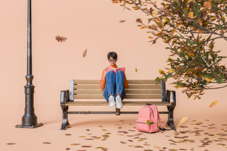 Woman wearing glasses and casual clothing sitting on a park bench reading a book, with a pink backpack on the ground and autumn tree nearby. Concept of relaxation and study. 3d renderingの写真素材