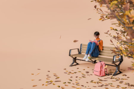 Woman wearing glasses and casual clothing sitting on a park bench reading a book, next to an autumn tree with falling leaves. Concept of relaxation, study, and autumn season. 3d renderingの写真素材
