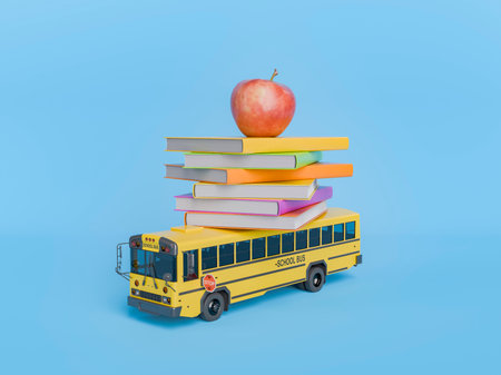 Miniature yellow school bus carrying a stack of colorful books and a red apple is set against a...