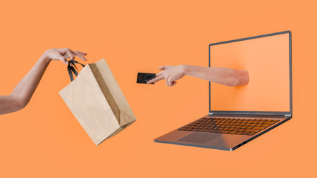 Hand giving a credit card and another receiving a shopping bag through a laptop screen on an orange background. 3d renderingの写真素材