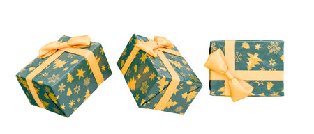 Festive christmas gifts wrapped in green paper with yellow ribbons isolated. Transparent background. 3d renderingの写真素材