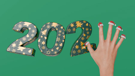 Hand completing the year 2025 with its fingers wearing santa hats, on a green background. 3d renderingの写真素材