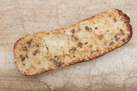 Loaf of freshly baked garlic french bread.の写真素材