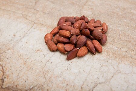 Pile of almonds on marble background.の写真素材