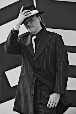 Dapper young man in urban setting wearing zoot suitの写真素材