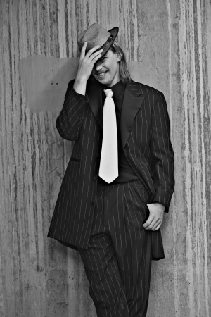 Dapper young man in urban setting wearing zoot suitの写真素材
