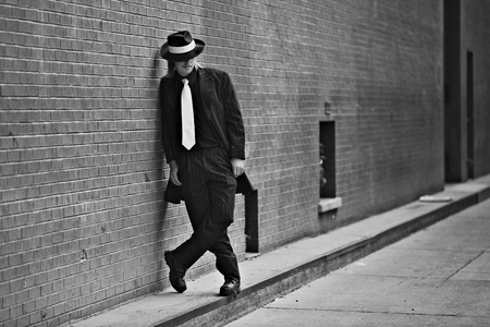 Dapper young man in urban setting wearing zoot suitの写真素材