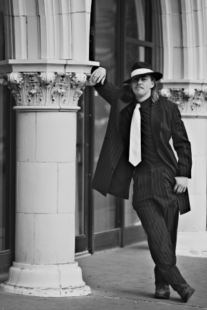 Dapper young man in urban setting wearing zoot suitの写真素材