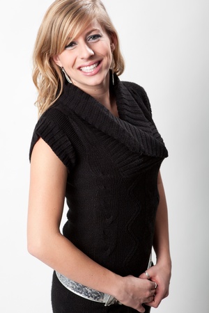 Studio headshot of pretty and happy blonde woman smiling for the cameraの写真素材