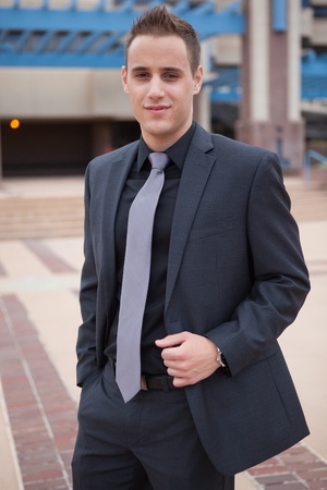 Young professional in a dark suit in the city の写真素材