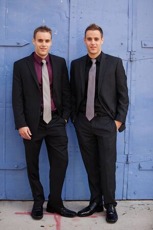 Handsome sharp dressed businessmen; identical twins の写真素材