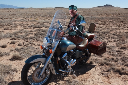Older gentleman and his motorcycleの写真素材