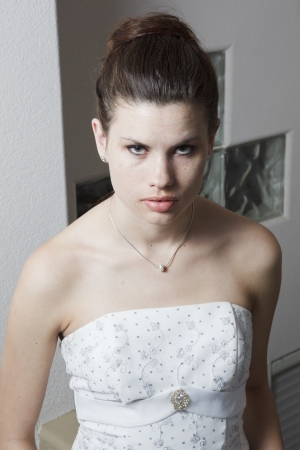 Head and shoulders portrait of intense young bride; perhaps she is nervous の写真素材