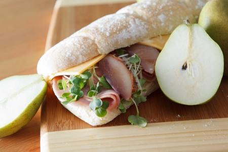 Ham and cheese sandwich on baugette with poached pearの写真素材