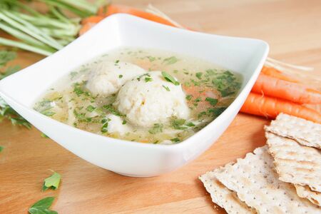 Matzah Ball Soup with carrots and Matzo breadの写真素材