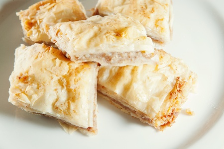 Golden flaky baklava on a plateの写真素材