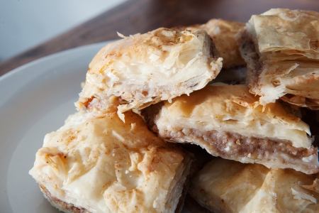 Golden flaky baklava on a plateの写真素材