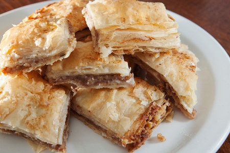 Golden flaky baklava on a plateの写真素材