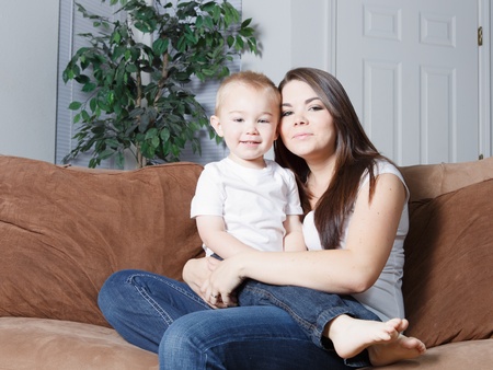 Smiling beautiful young  mom and toddler blond sonの写真素材