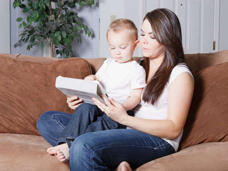 Mom and son early childhood e-learning on computer tabletの写真素材