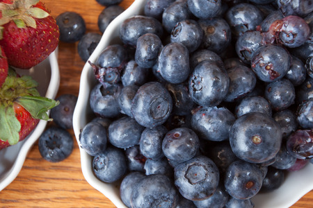 top down blueberries in white dishの写真素材