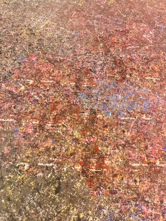 Close-up of a colorful abstract texture with layered paint splatters, brush marks, and artistic details. Ideal for background, creative design, or digital art use.の写真素材