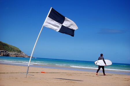 A surfer and surf area flag.の写真素材