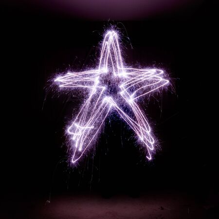 Christmas star made from sparklers.の写真素材