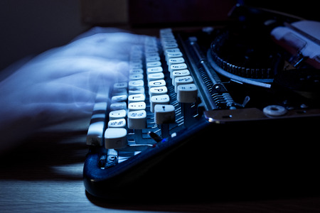 Typing notes on an old vintage typewriter の写真素材