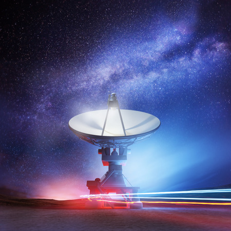 A radio telescope pointing upwards into the night sky. Astronomy background. Illustration.の写真素材