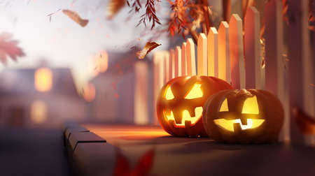 Glowing candle lit Jack O Lantern Halloween pumpkin decorations outside on a suburban street...
