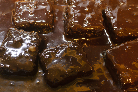 Brown shiny sweet chocolate cakes close up photo. Food photo.の写真素材