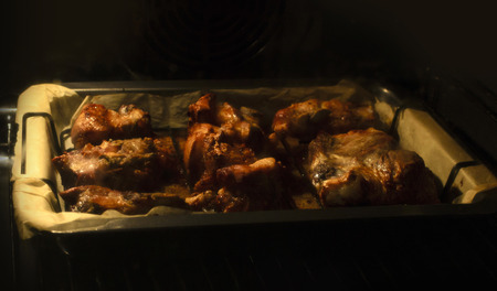 Chicken meat is baked in oven process cooking. Food photo.の写真素材