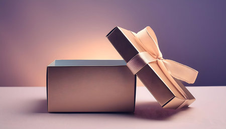 A gold gift box with a white ribbon is open on a table. The box is partially open, revealing the empty interior. The background is a soft gradient of purple and pink, suggesting a celebratory or romantic occasion. The image is focused on the box and its details, emphasizing the anticipation and excitement of receiving a gift.の素材