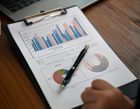 Close up of a business report, illustrating data analysis, financial information, and professional documentation.の素材