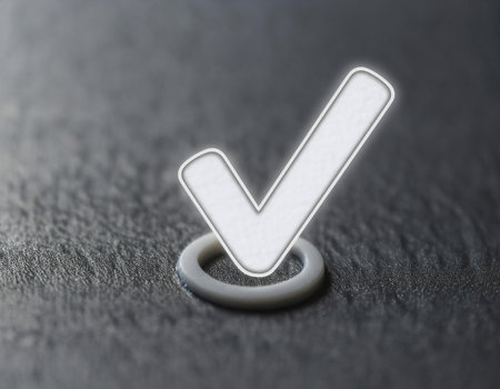Close up image of a check mark used to indicate correctness, accuracy, and validation.の素材