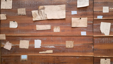 A worn, shabby poster featuring a rippled print and sparse sticker elements. The design, showing straight lines and irregularities, highlights issues in presentation, making it ideal for science-themed displays or problem-related graphics.の素材