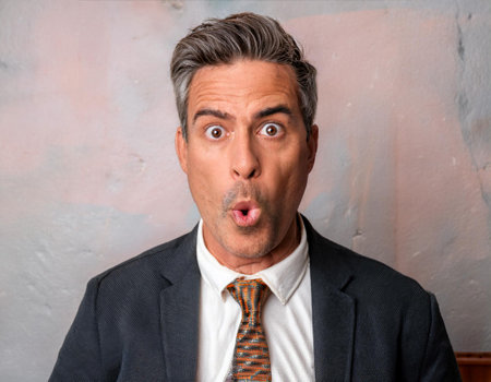 Close up image of a person with a surprised expression, illustrating astonishment, unexpected events, and emotional reactions.の素材