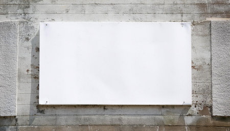 Close-up image of an advertisement poster on a wall, symbolizing marketing, promotion, and publicity.の素材