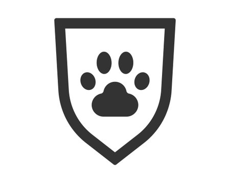 Simple icon featuring a paw print within a shield. Illustrates protection, care, and safety for animals. Ideal for pet services, veterinary clinics, and animal shelters.のイラスト素材