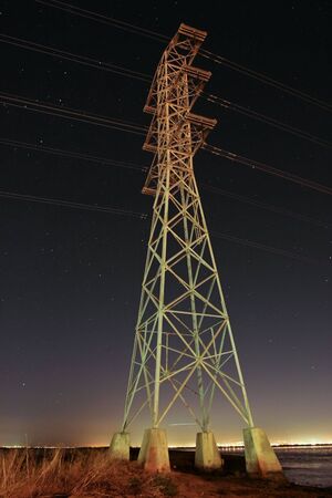 High Tension Powerline Tower, Night, SF Bay near Dumbarton Bridgeの写真素材