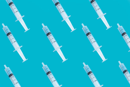 Plot in light blue background with needles to fight viruses and bacteria such as Covid-19の写真素材