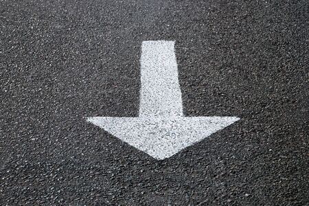 Road marking on asphalt in the form of an arrow