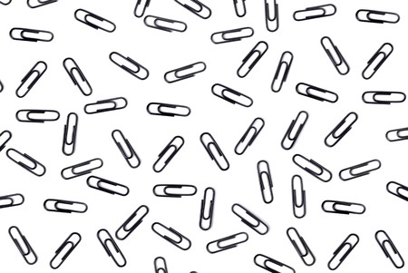 Set of writing paper clips on the white