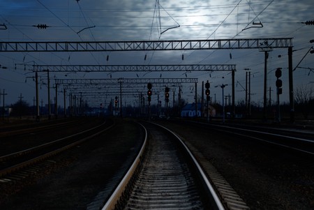 Empty railroad tracks at nights with moonlightの写真素材